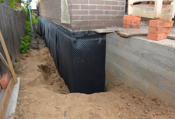Happy homeowners after waterproofing job in Wayne